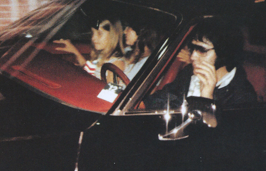Elvis, Ginger and Lisa Marie driving through the Graceland gates on August 12, 1977.
