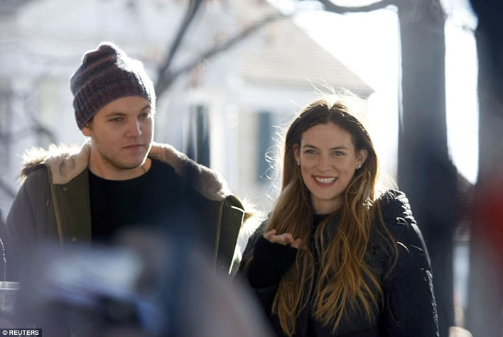 Elvis Presley's grandchildren Ben Keough (L) and Riley Keough stand in front of Graceland January 8, 2015.