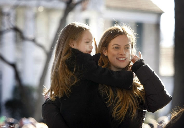 Riley Keough holds her little sister Finley Lockwood in front of Graceland January 8, 2015.