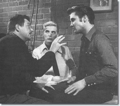 Hal Kanter, Lizabeth Scott and Elvis Presley on the set of 'Loving You'.
