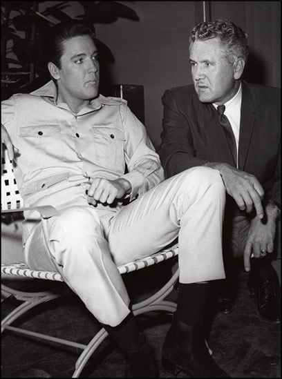 Elvis and Vernon Presley on a movie set.